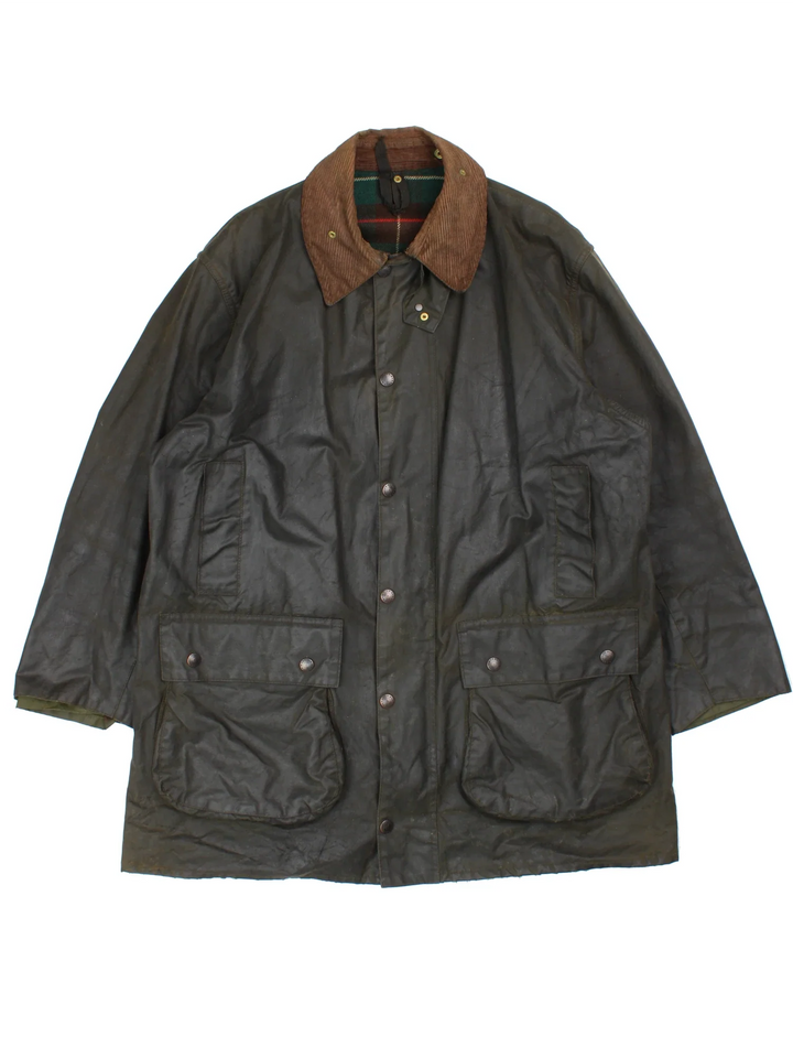 Barbour Northumbria Wax Jacket in a green colourway. Zip/button fastening, with multiple pockets, cord collar detail and checked lining.