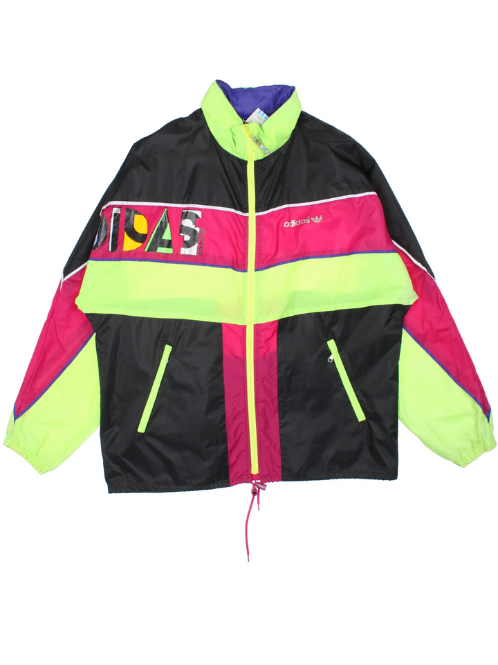 Vintage 80's Adidas Windbreaker in a black/pink colourway. Zips up and has side pockets, contrast colour panels and logo printed on the front.
