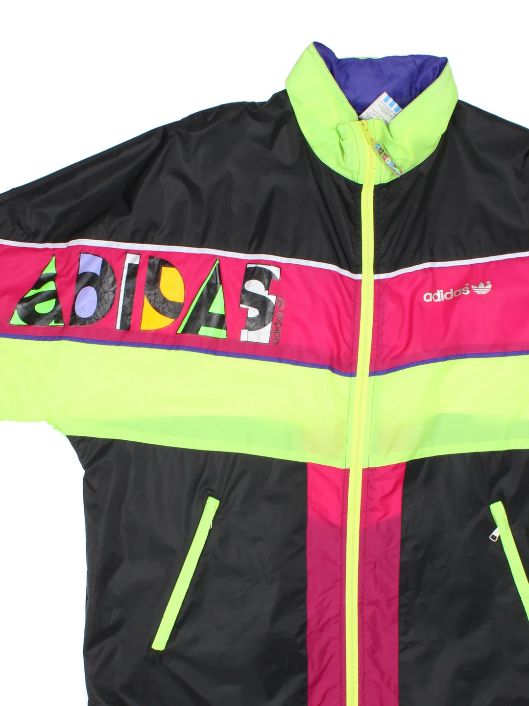 Vintage 80's Adidas Windbreaker in a black/pink colourway. Zips up and has side pockets, contrast colour panels and logo printed on the front.