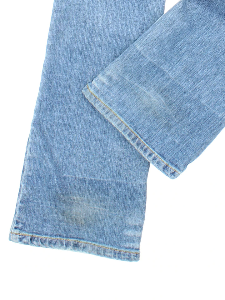 Lee Flared Jeans in blue colourway, with multiple pockets, contrast stitching and embroidered branding on the back.