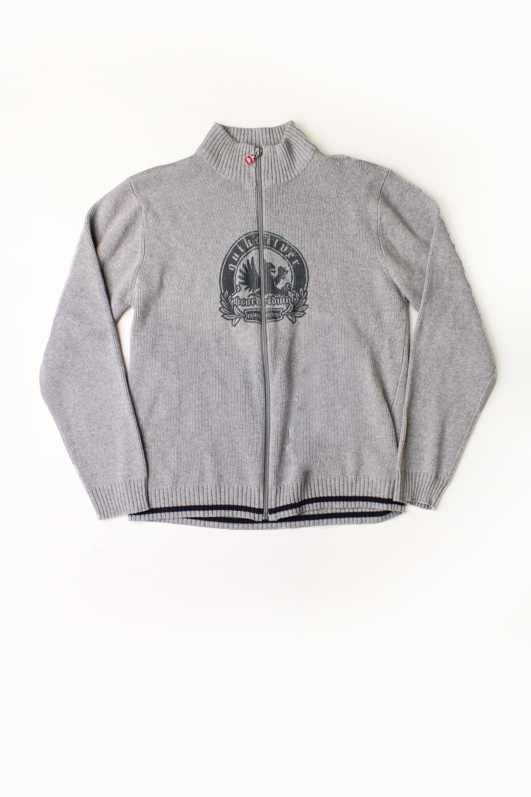 Quiksilver grey knit zip-up cardigan with a collar, a circular griffin 'boarding' logo, black stripe detail on the bottom hem, and a red Quiksilver logo zip pull.