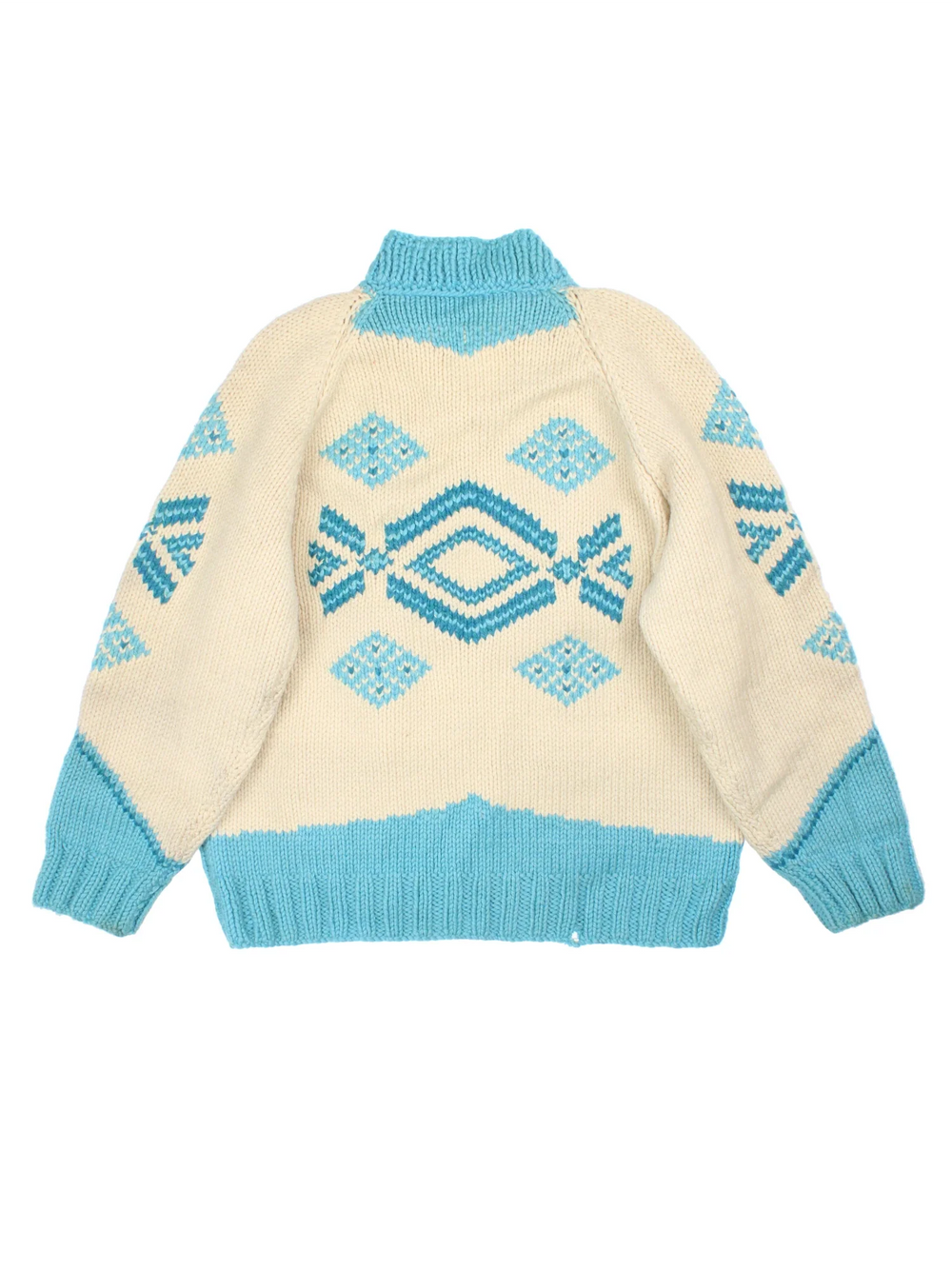 Vintage 80's Snowflake Cowichan Knitted Sweater in a tan and blue colourway with snowflake patterns all over, zip up closure and has double front pockets.