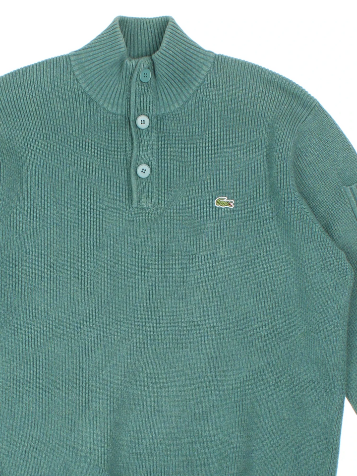 90's Lacoste Jumper in a green colourway with 1/4 zip/button neckline and branding embroidered on the front.