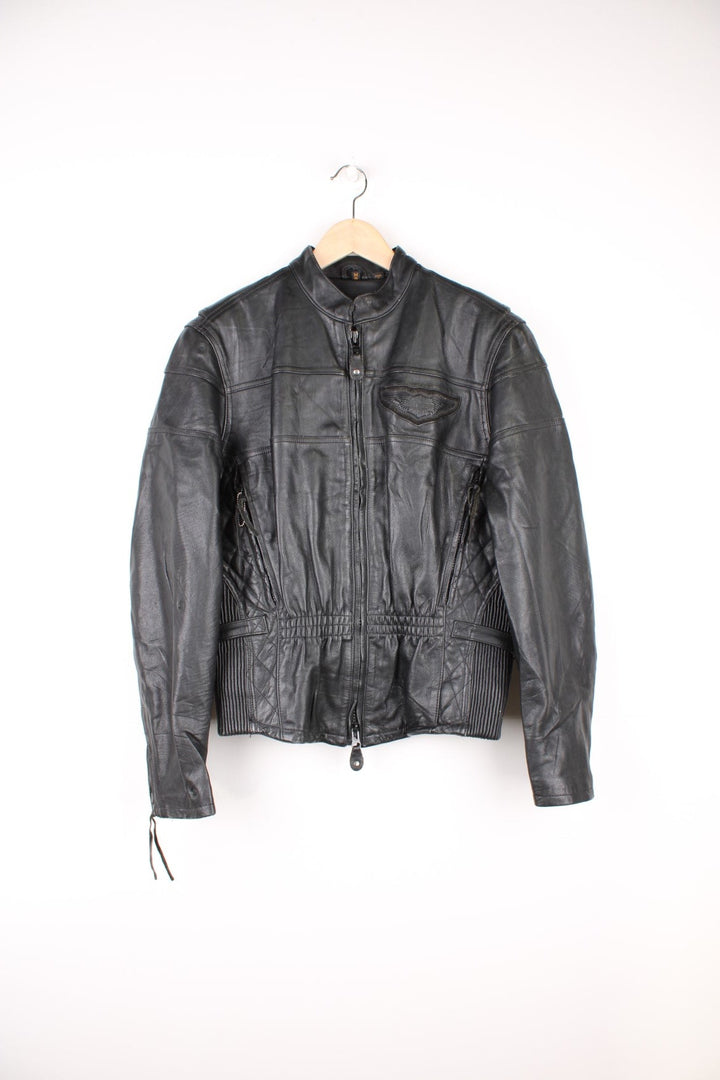 Harley Davidson Motorcycle Jacket in a black colourway, zip up with side pockets, has adjustable waistline buckles, air vent zip on the back, mesh lining, and the logo embroidered on the front and spell out on the back.
