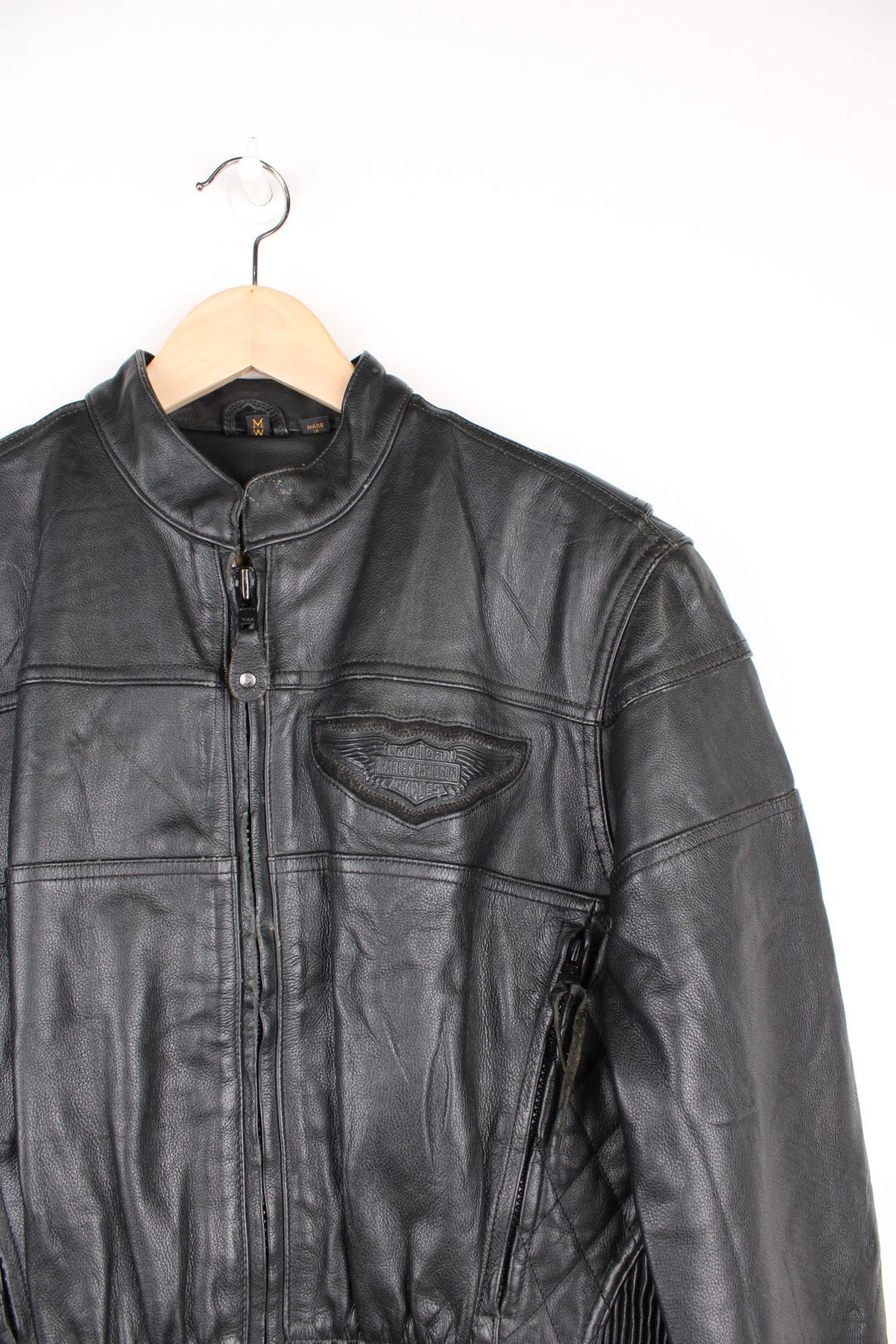 Harley Davidson Motorcycle Jacket in a black colourway, zip up with side pockets, has adjustable waistline buckles, air vent zip on the back, mesh lining, and the logo embroidered on the front and spell out on the back.