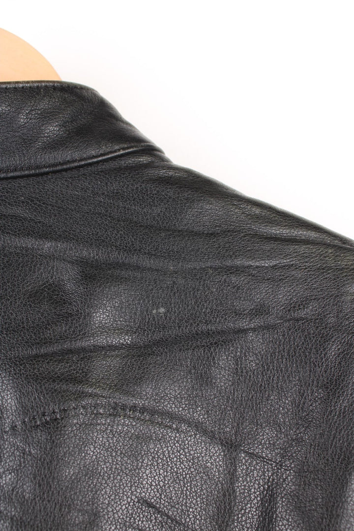 Harley Davidson Motorcycle Jacket in a black colourway, zip up with side pockets, has adjustable waistline buckles, air vent zip on the back, mesh lining, and the logo embroidered on the front and spell out on the back.