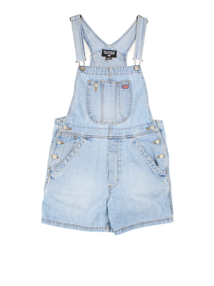 Ralph Lauren Short Dungarees in blue colourway with multiple pockets, adjustable straps and the logo embroidered on the front/back.