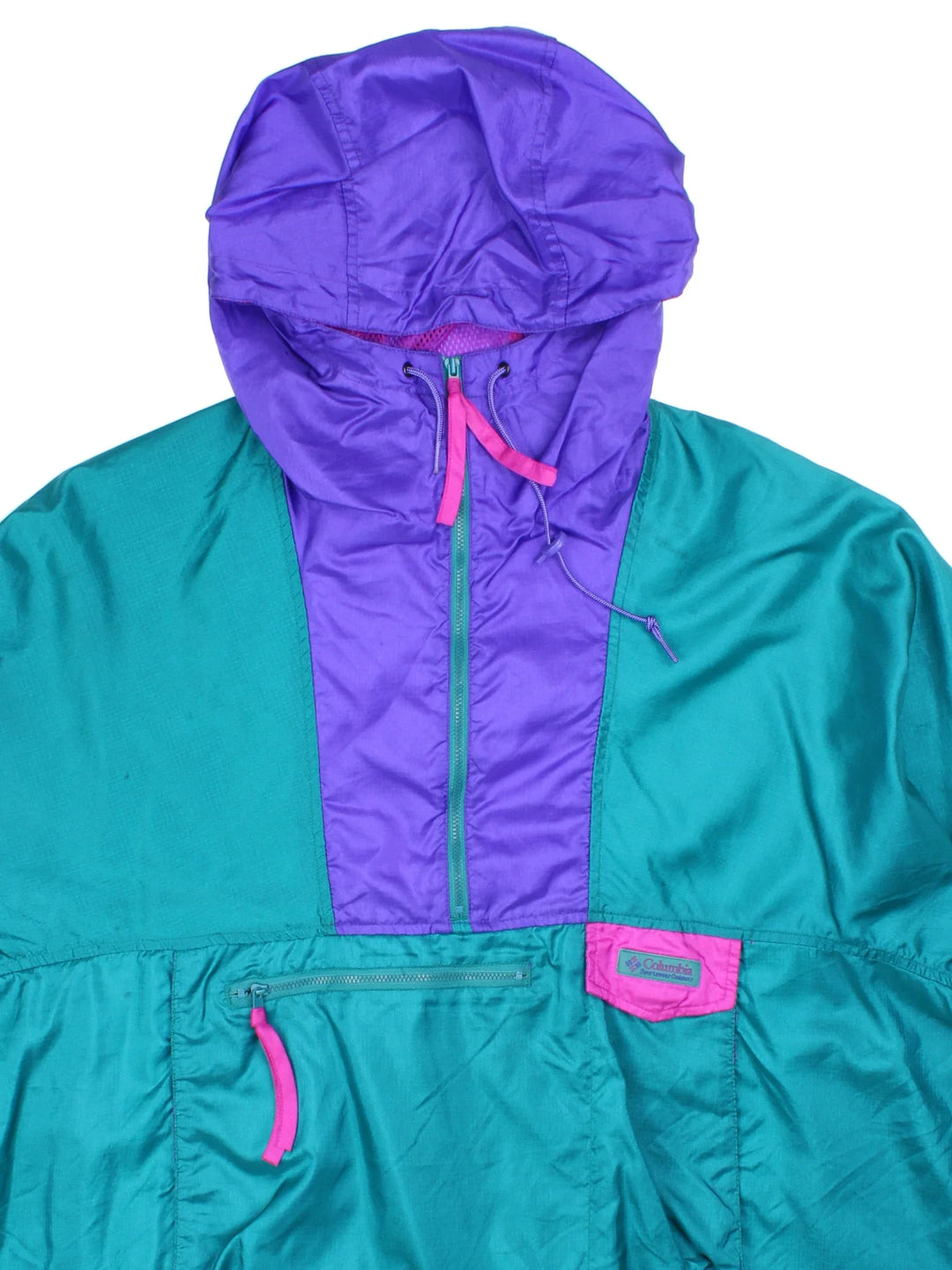 Vintage 90's Columbia Windbreaker Jacket in a green/purple colourway. 1/4 zip fastening, hooded and has large front pocket. Drawstring hem and has the logo embroidered on the front.