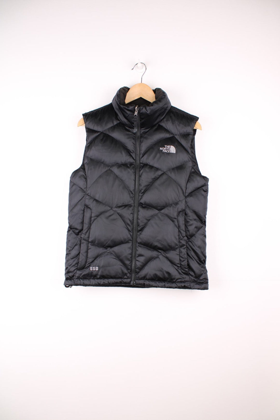 The North Face 550 all black double pocket satin gilet with embroidered logo on the front and back
