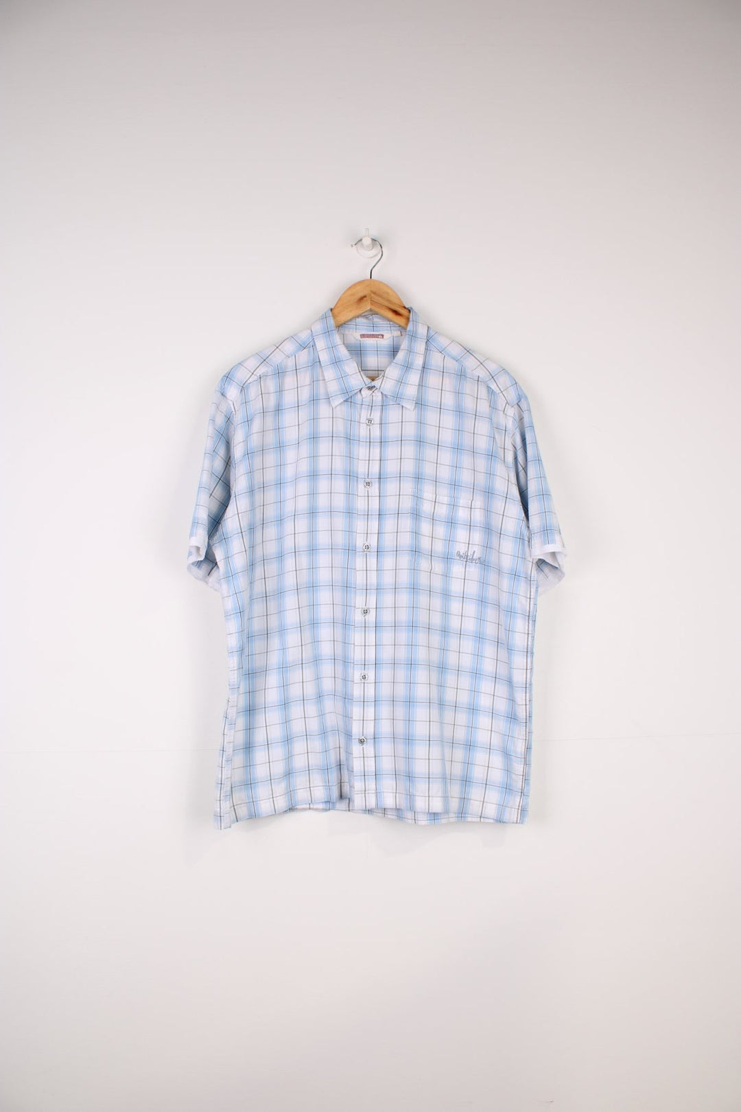 Quiksilver Plaid Shirt in a blue, black and white colourway, button up and has a chest pocket with the logo embroidered on it.