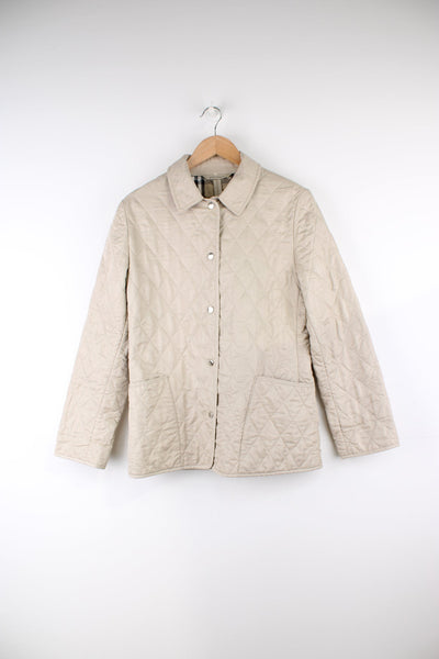 Burberry made in England, button up quilted jacket in tan, Features signature nova check lining, metal hardware and pockets