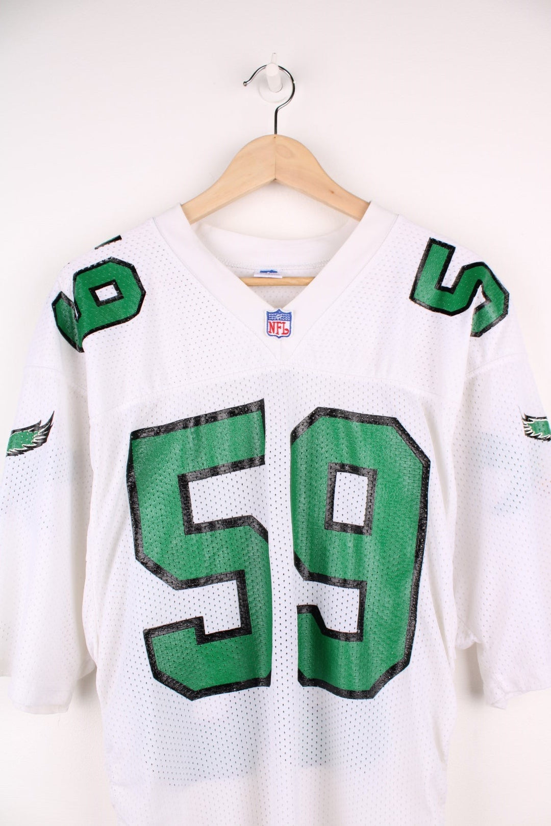 90's NFL Philadelphia Eagles Russell Athletic Jersey in a white, green and black colourway, Seth Joyner number 59 printed on the back and on the front with logos.
