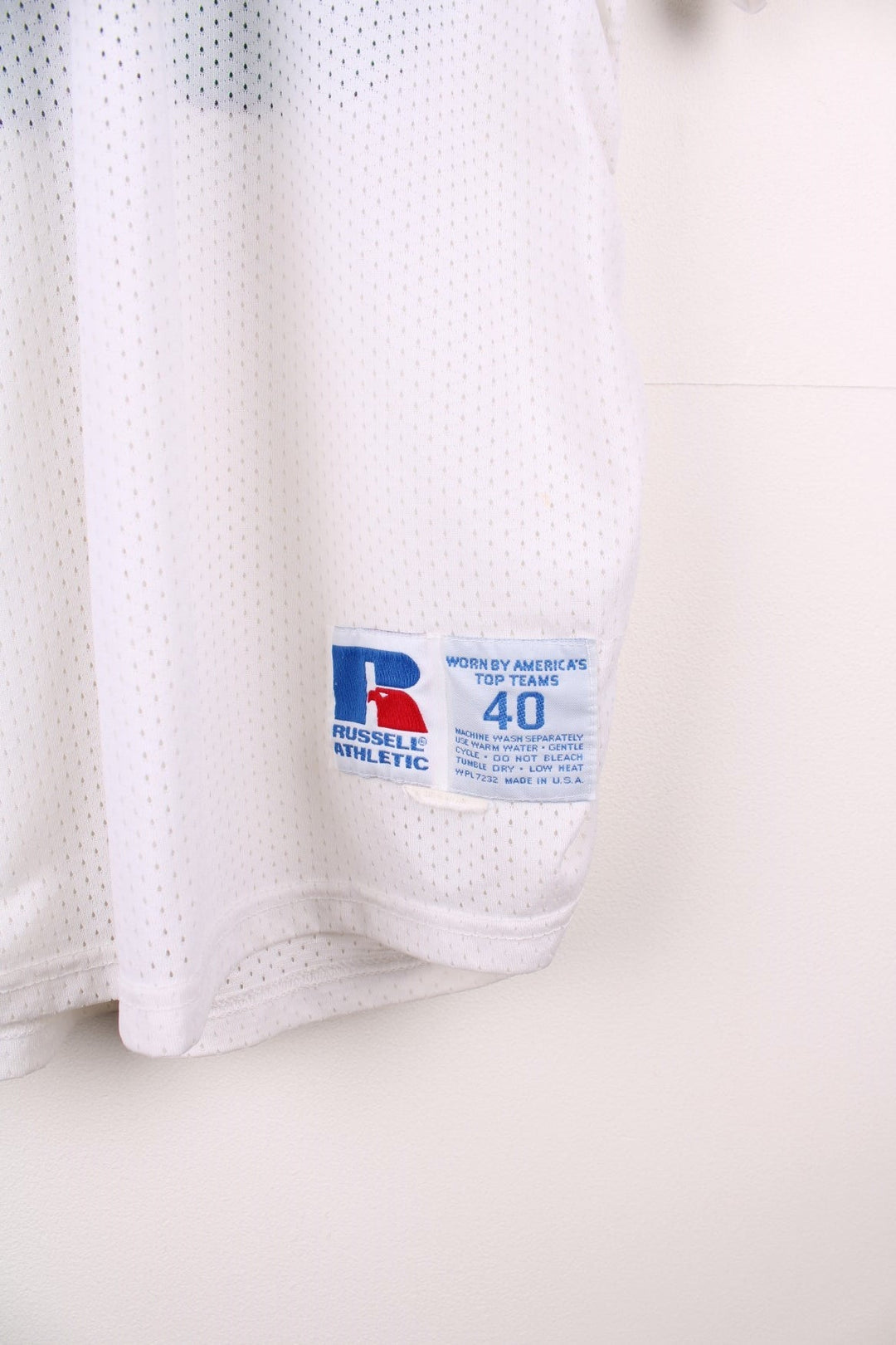 90's NFL Philadelphia Eagles Russell Athletic Jersey in a white, green and black colourway, Seth Joyner number 59 printed on the back and on the front with logos.