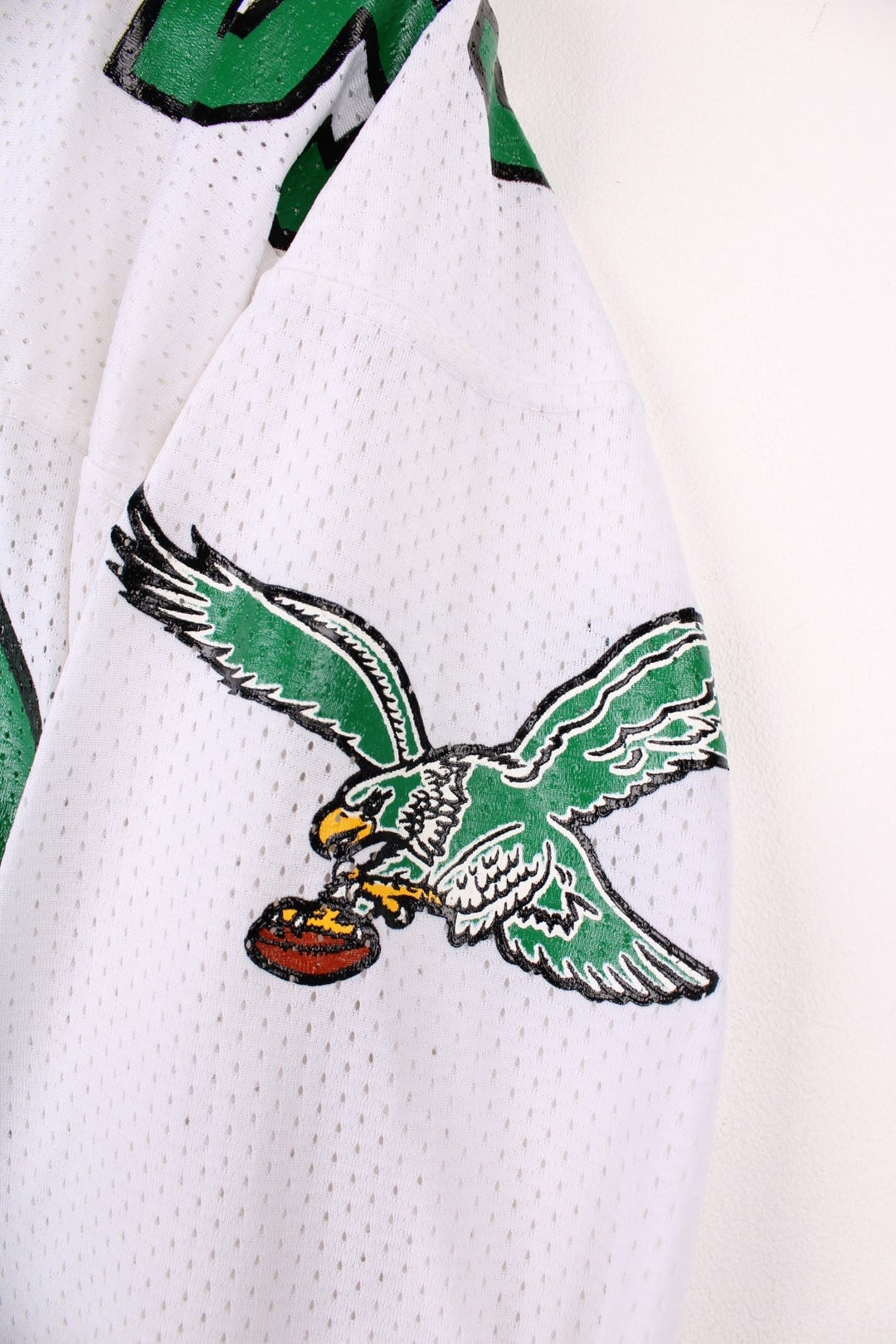 90's NFL Philadelphia Eagles Russell Athletic Jersey in a white, green and black colourway, Seth Joyner number 59 printed on the back and on the front with logos.
