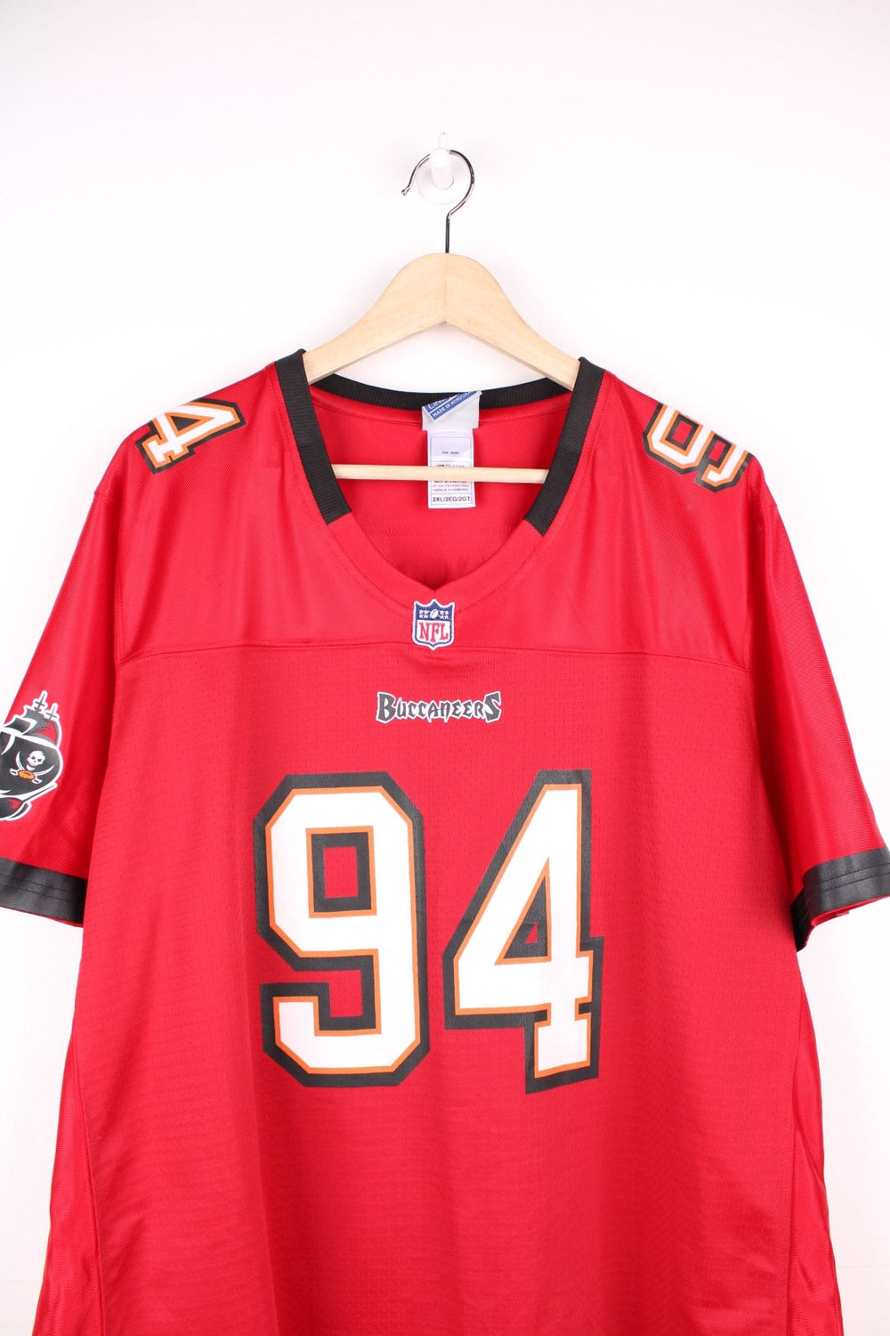 NFL Tampa Bay Buccaneers Shirt in a red colourway, Adrian Clayborn number 94 printed on the back, and has the logos printed on the front.