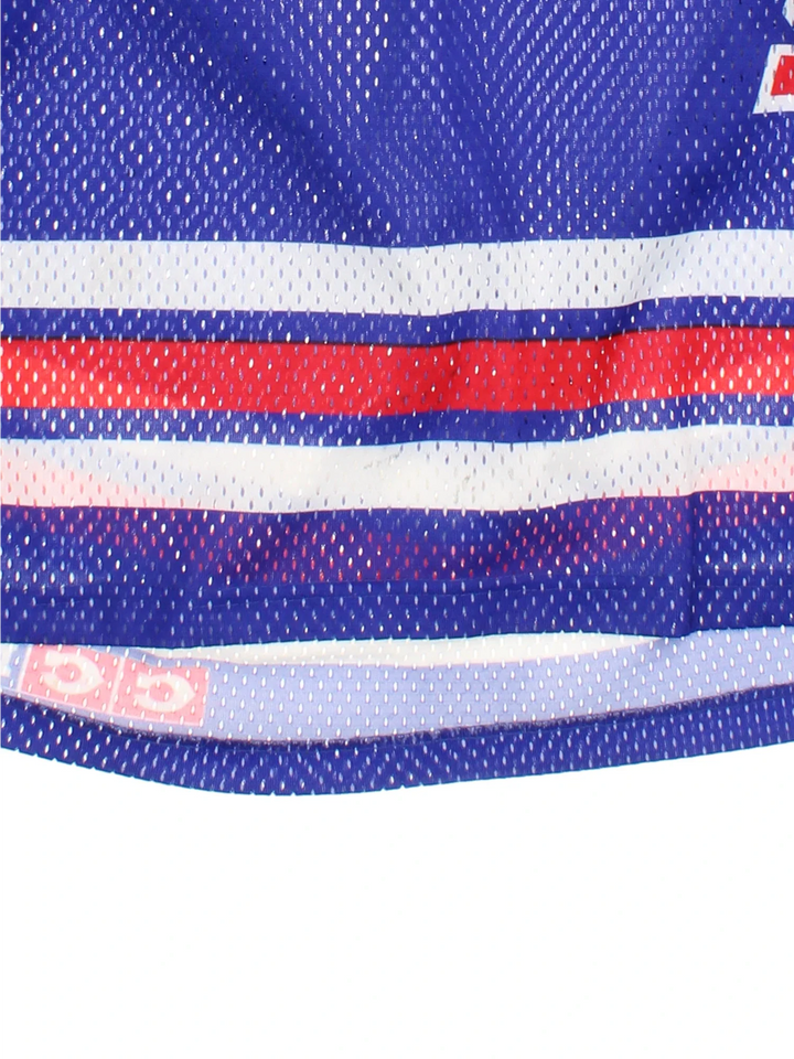 New York Rangers NHL Jersey in the blue/red team colourway, features V neckline, printed logos and badge on the front.
