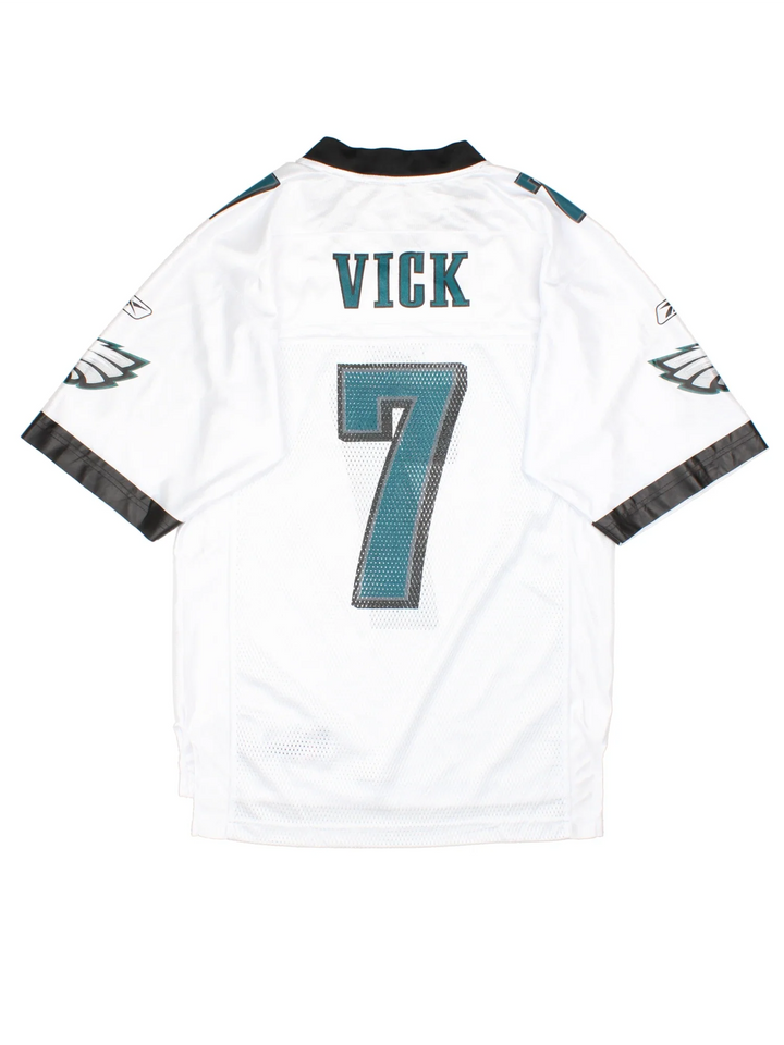 Philadelphia Eagles Reebok NFL Jersey in a white colourway with black and green detailing, features printed logos and badge on the front and player name VICK #7 on the back.