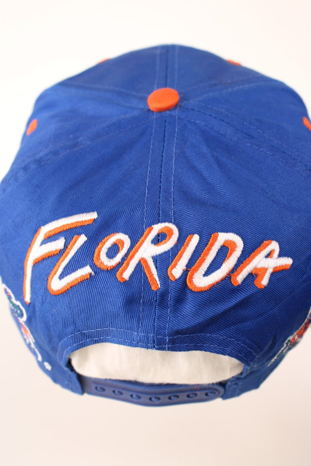 Vintage Florida Gators Cap in blue and orange with adjustable strap on the back.