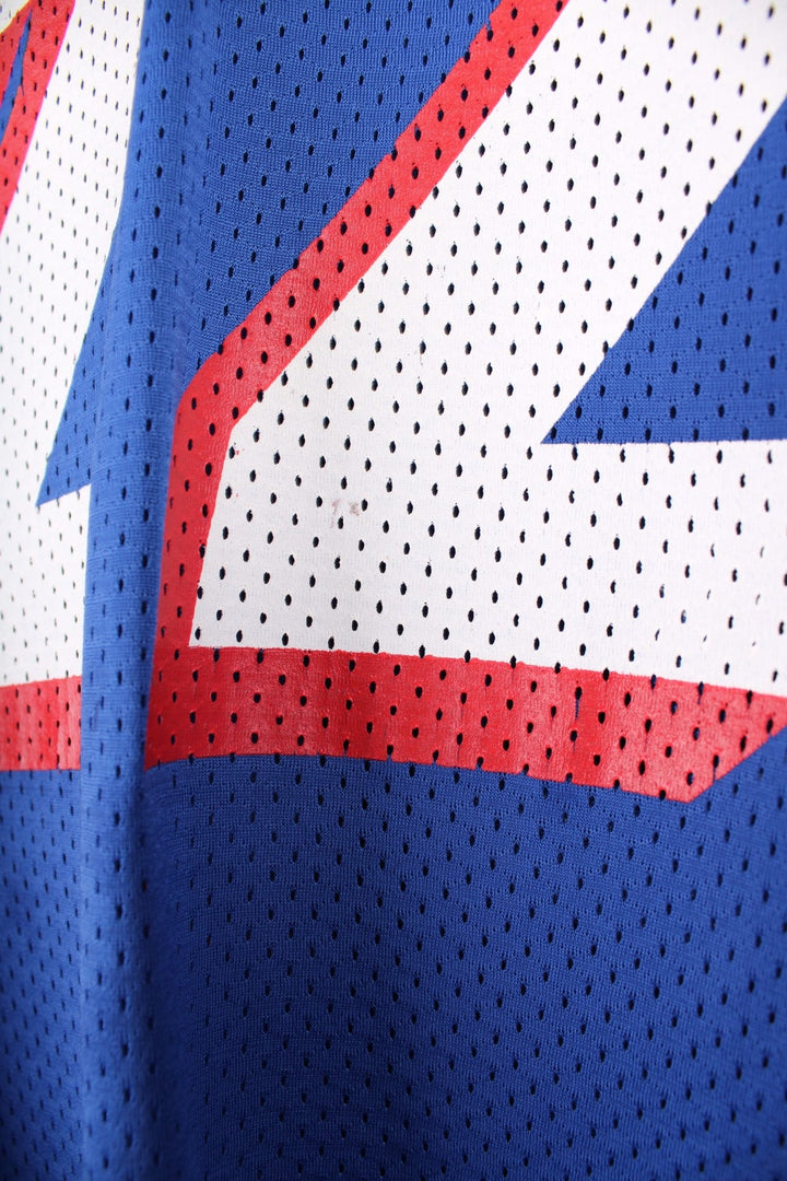 Champion New England Patriots jersey in blue with red and white accents, embroidered champion logos, printed team logos, and no. 22 Meggett on the back.