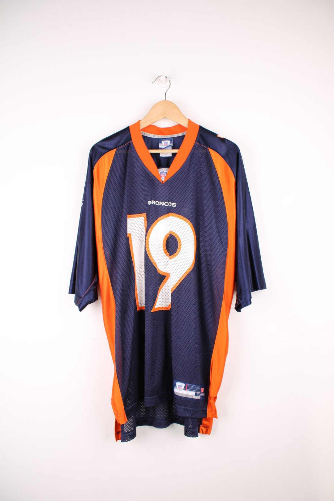 Denver Broncos, Royal #19, Reebok NFL jersey in a blue and orange colourway. Features printed 19 on the front and back.