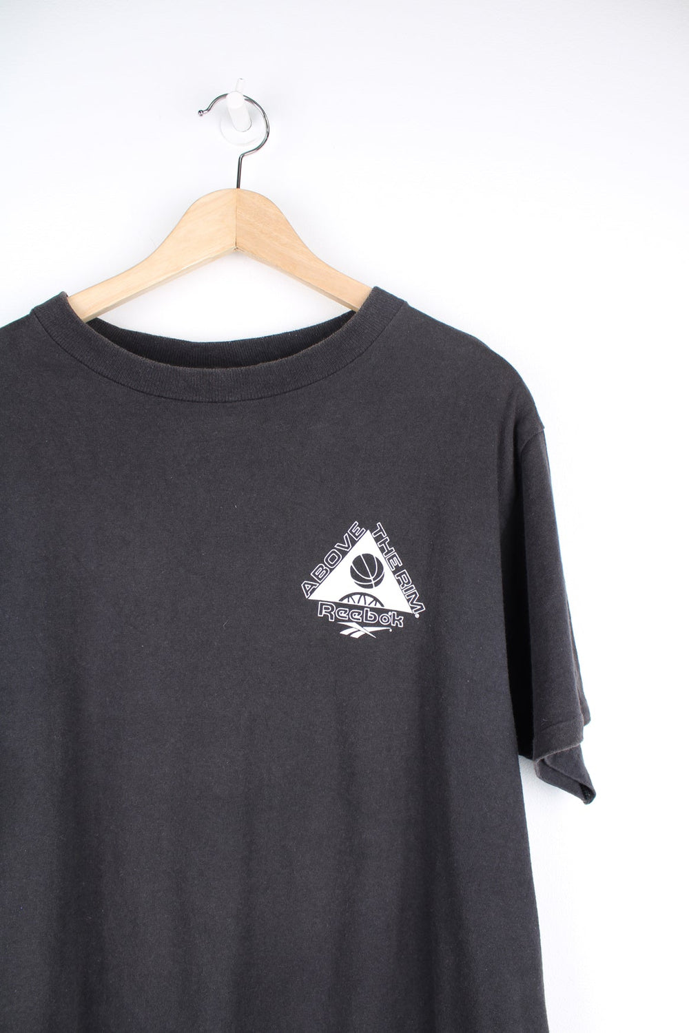 Vintage 90s Above the Rim Reebok single stitch T-Shirt with printed logo on the front and back.