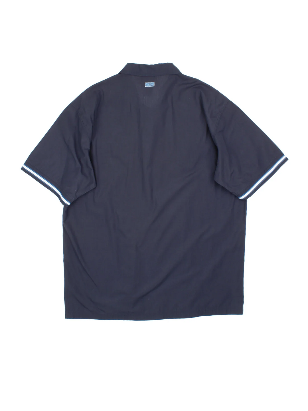 Adidas Shirt in a blue colourway. Button up fastening, with front pocket, contrast piping and embroidered logo on front/patch logo on back .