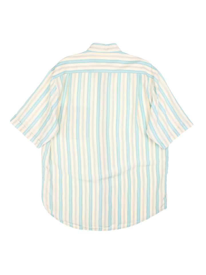 1990s Paul & Shark Shirt in a tan, grey and blue striped colourway. 100% silk with a patch pocket, and the Paul and Shark logo embroidered on the front.