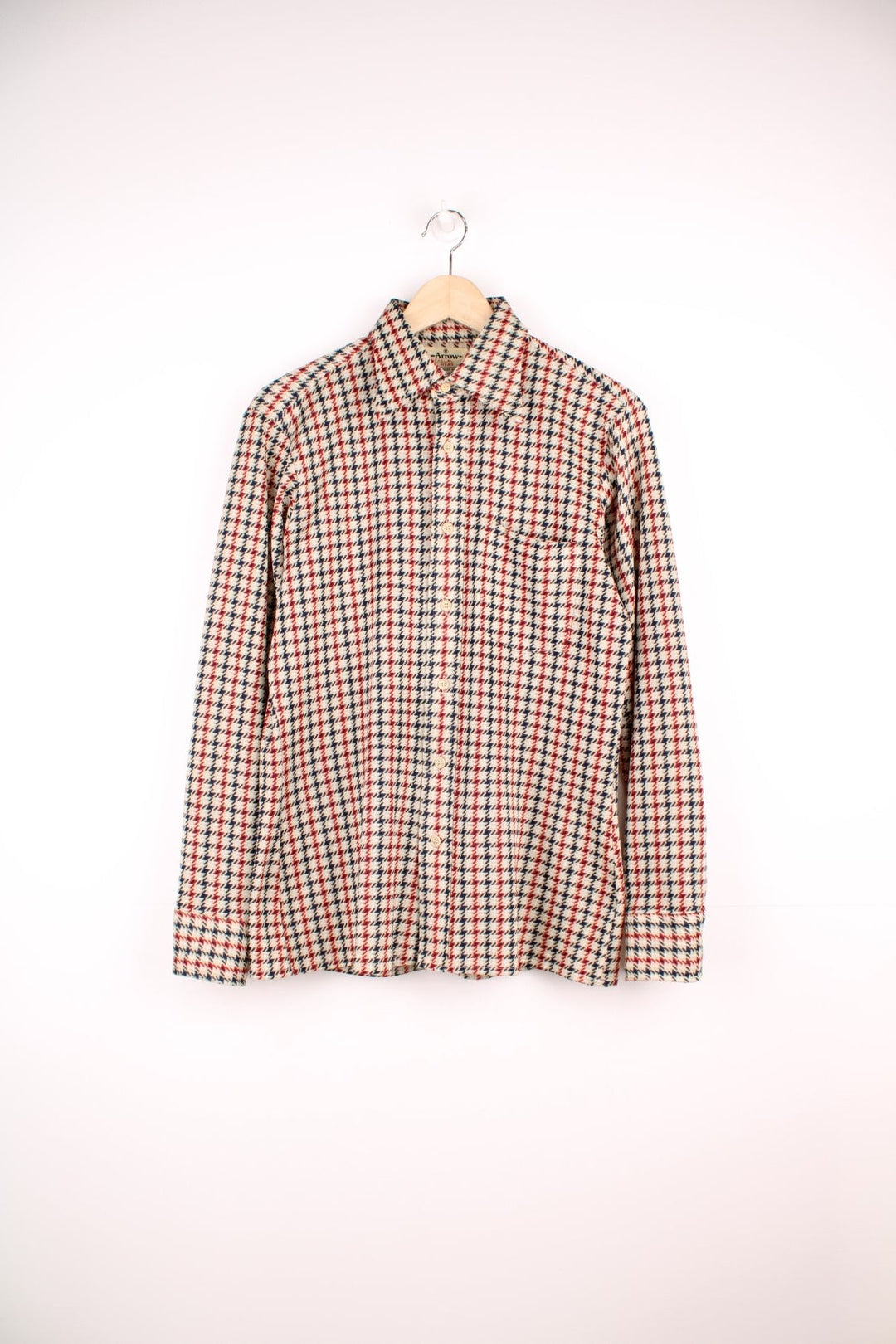 Vintage 70's Arrow Scrammbler Knit Shirt in a tan, red and blue checkered colourway, button up with a dagger collar, and has a chest pocket.