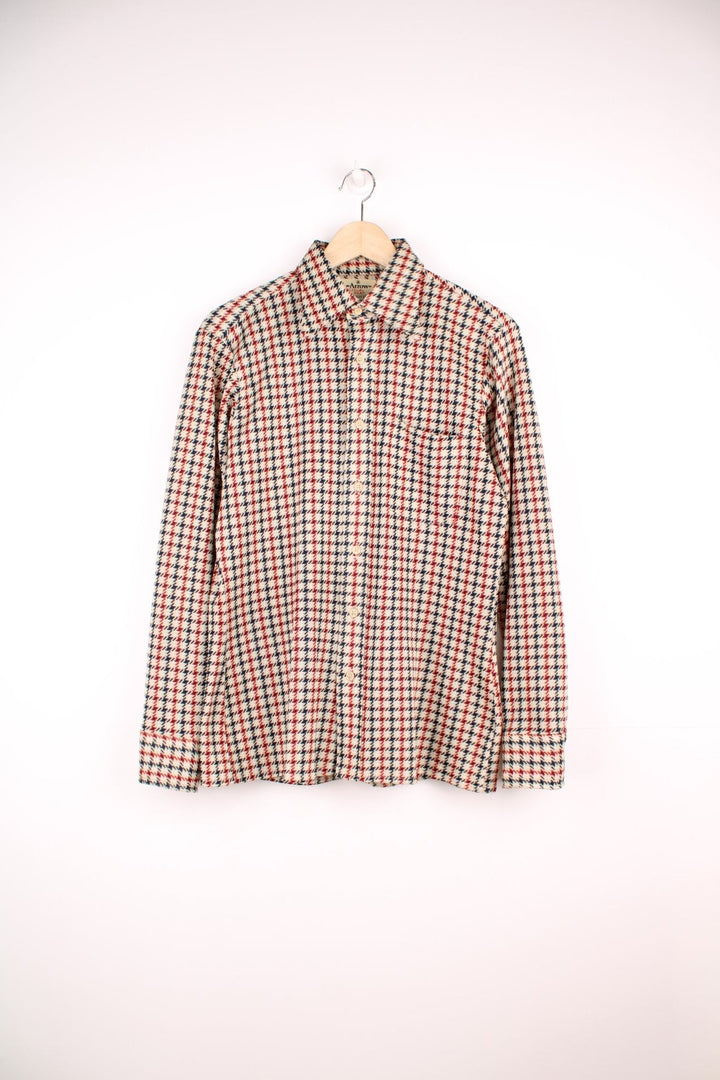 Vintage 70's Arrow Scrammbler Knit Shirt in a tan, red and blue checkered colourway, button up with a dagger collar, and has a chest pocket.