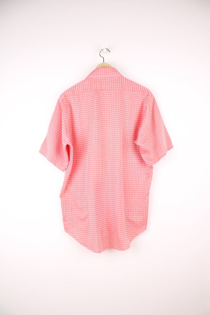 Vintage 70s pink and red patterned shirt with a dagger collar and pocket on the chest.