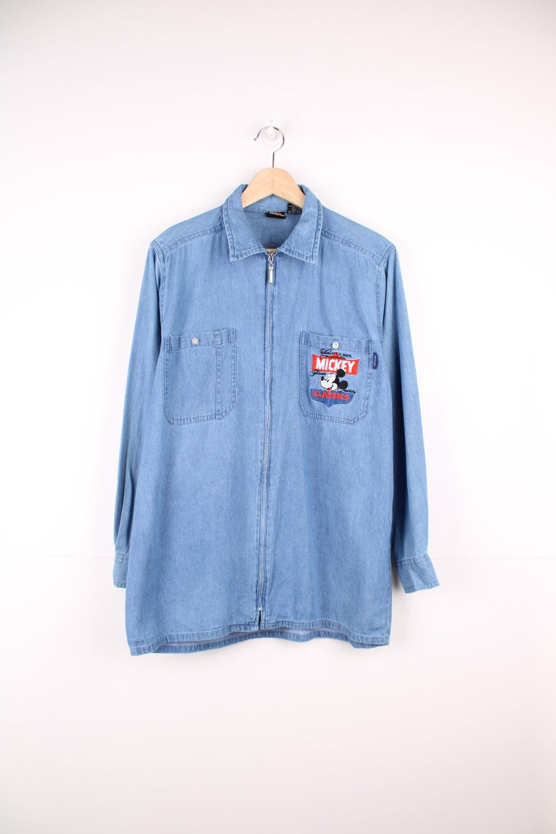 Vintage Mickey Unlimited zip through denim shirt with chest pockets and embroidered Mickey Classics logo.