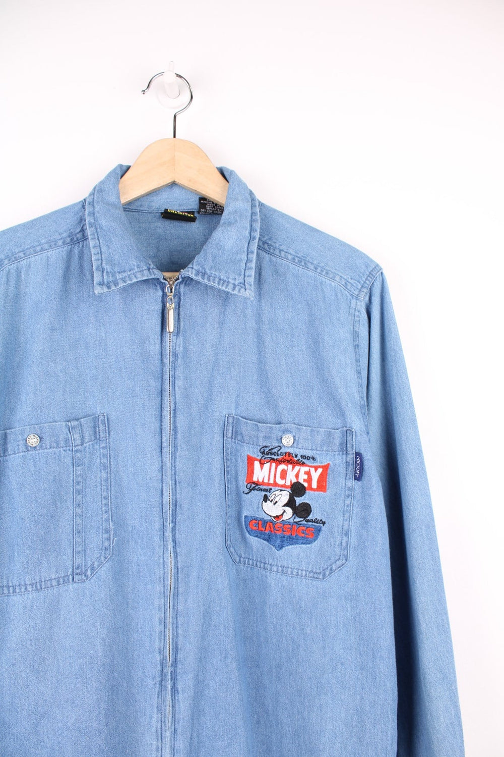 Vintage Mickey Unlimited zip through denim shirt with chest pockets and embroidered Mickey Classics logo.
