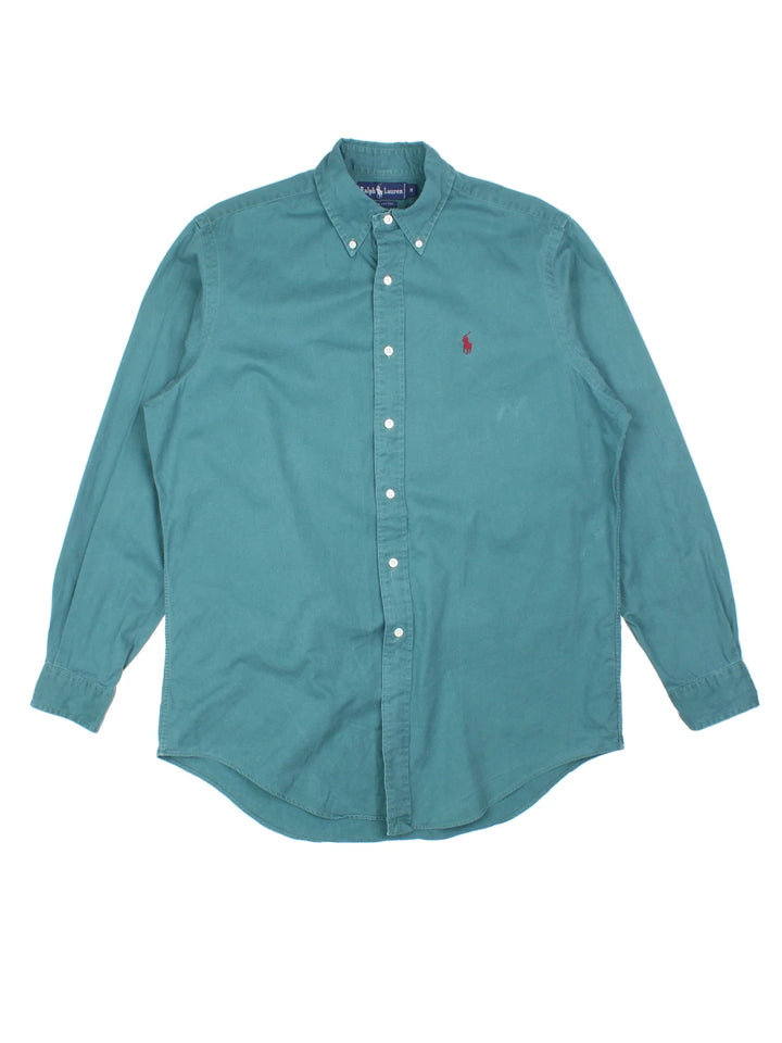 Ralph Lauren Shirt in a blue colourway, button up with the logo embroidered on the front.