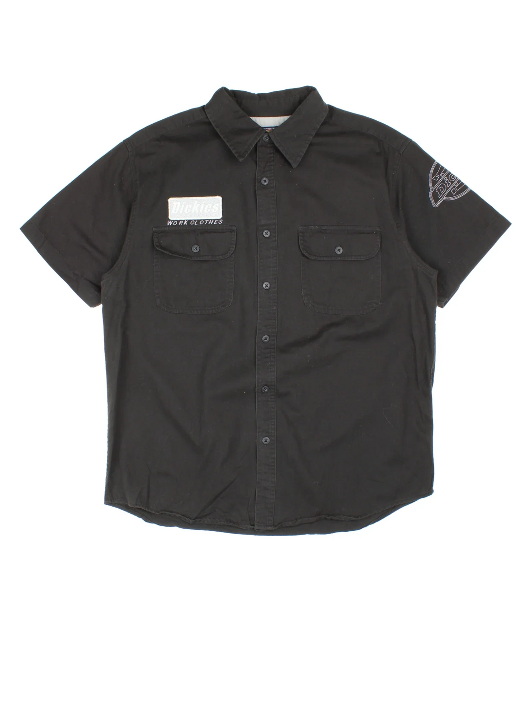 Dickies Work Shirt in a black colourway, button up and has double chest pockets with the logo embroidered on the front and left sleeve.