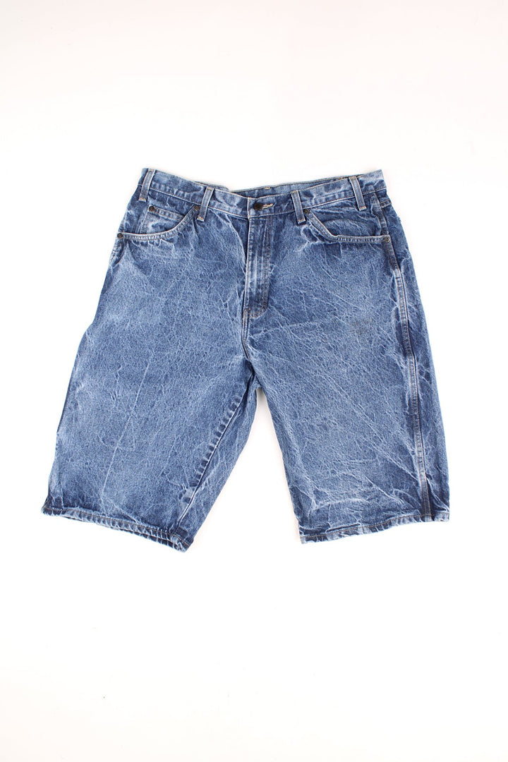 Dickies Carpenter Shorts in a stone wash blue denim colourway, has multiple pockets and the logo embroiderd on the back pockets.