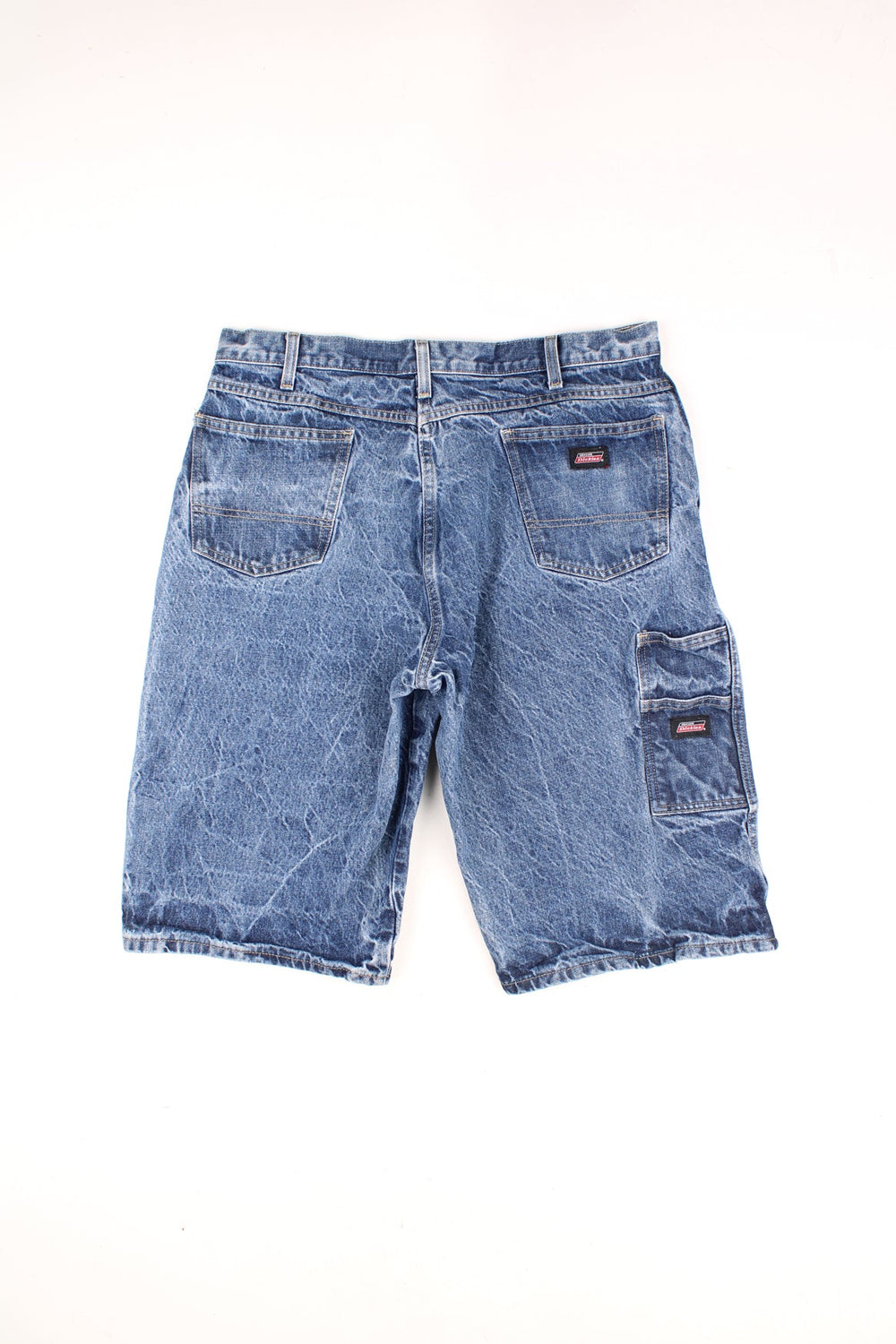 Dickies Carpenter Shorts in a stone wash blue denim colourway, has multiple pockets and the logo embroiderd on the back pockets.