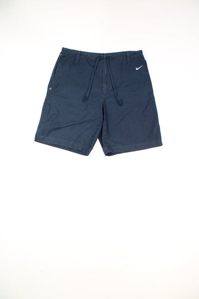 Nike navy blue highwaisted cotton shorts, features embroidered swoosh logo on the hip and drawstring waist