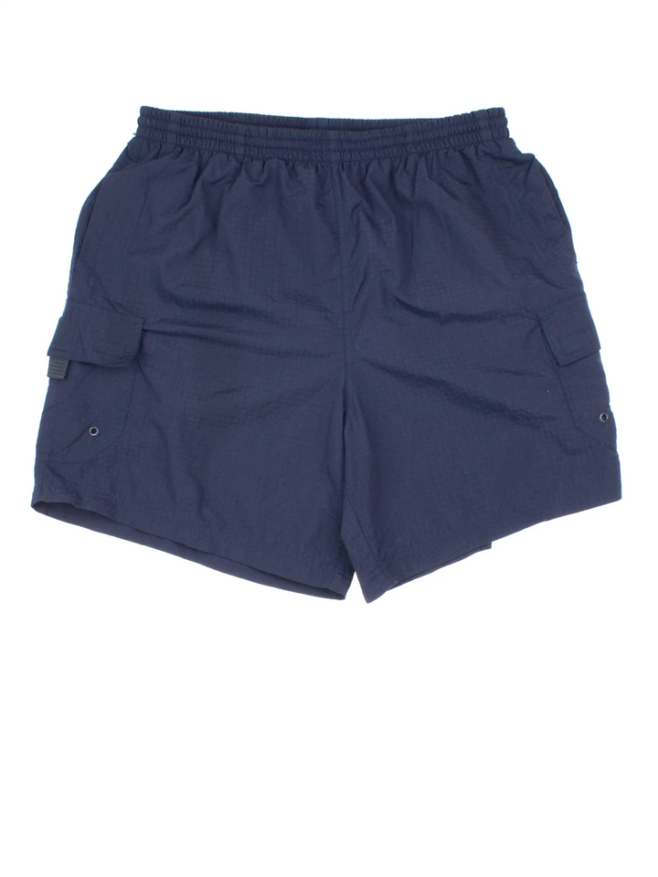 Vintage Ellesse Shorts in blue colourway with cargo pockets and netted lining.