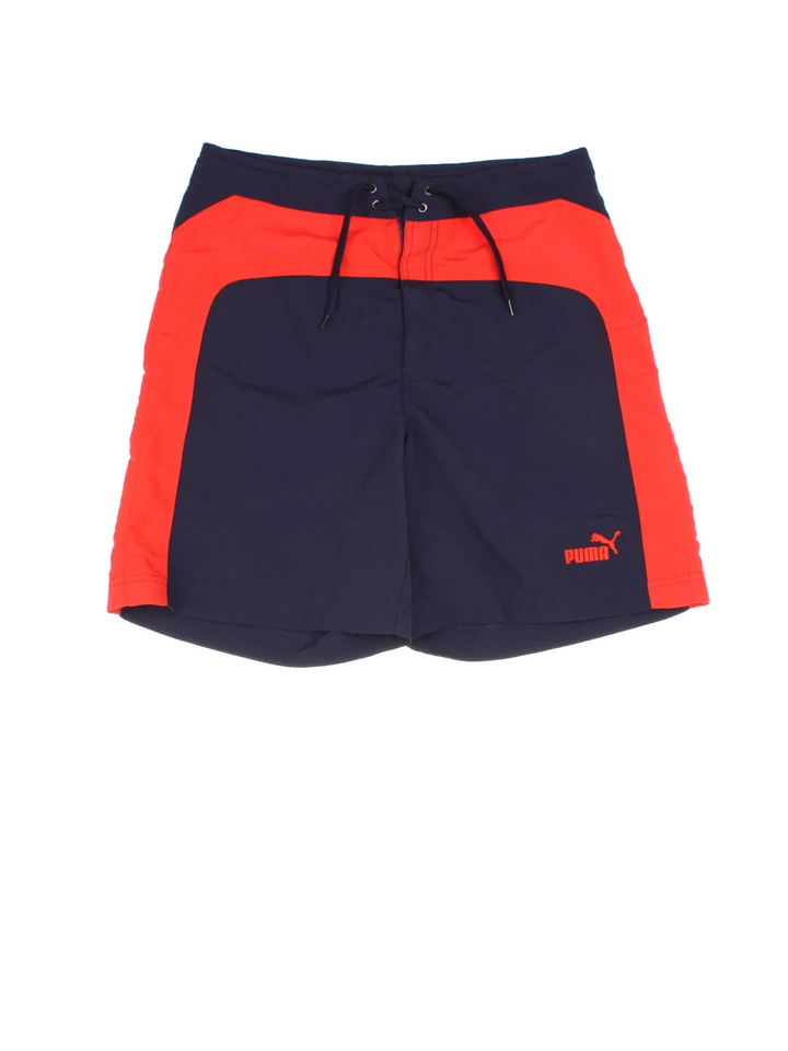 Vintage Puma shorts in blue/red colourway with lace up fastening and the logo embroidered on the front.