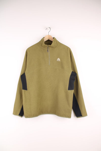 Nike ACG Fleece in a green and black colourway, quarter zip up with the logo embroidered on the front. 