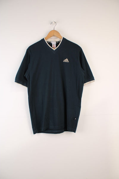 Adidas T-Shirt in a green colourway, v neck and has the logo embroidered on the front. 