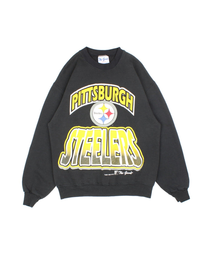 Vintage 1995 Pittsburgh Steelers NFL Sweatshirt in a black colourway with the team logo and spell out printed on the front.