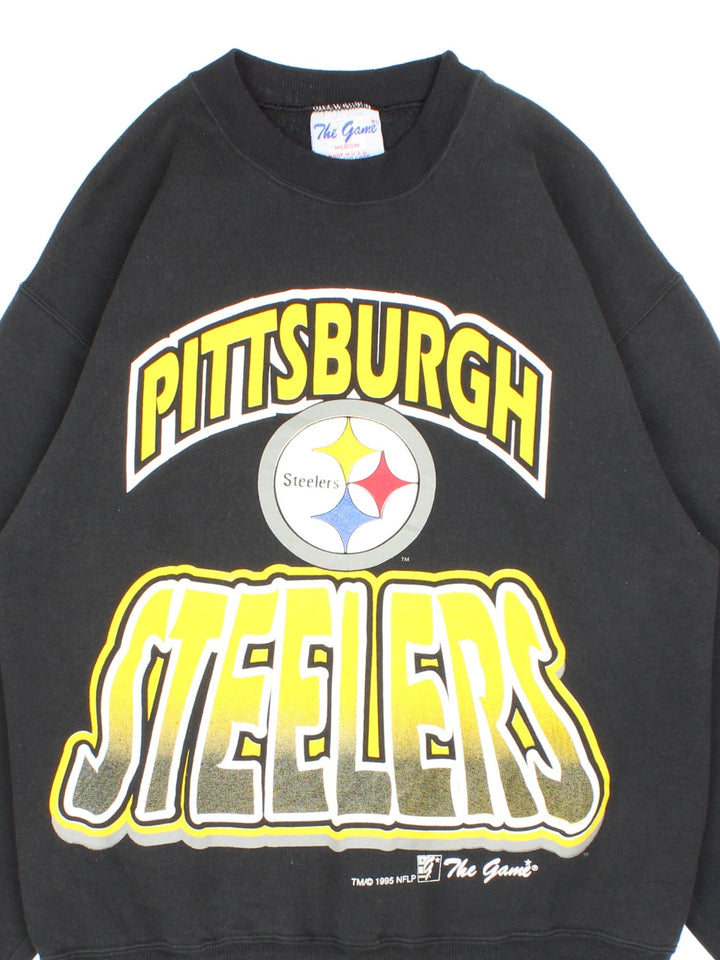 Vintage 1995 Pittsburgh Steelers NFL Sweatshirt in a black colourway with the team logo and spell out printed on the front.