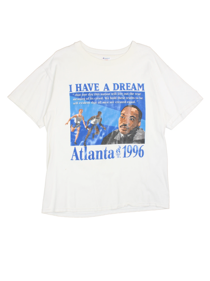Champion 1996 Atlanta Olympics Martin Luther King Jr T-Shirt in a white colourway with the 'I Have a Dream' quote printed on the front alongside a graphic print of runners and Martin Luther King Jr.