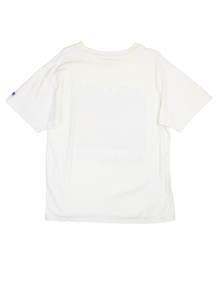Champion 1996 Atlanta Olympics Martin Luther King Jr T-Shirt in a white colourway with the 'I Have a Dream' quote printed on the front alongside a graphic print of runners and Martin Luther King Jr.