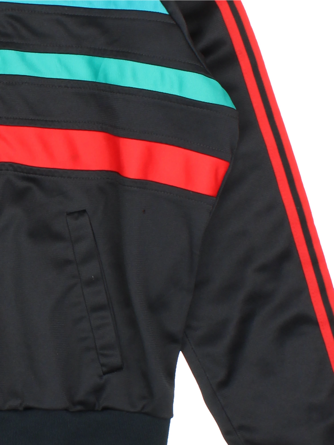 Vintage 80s Adidas tracksuit top in black with red and green stripes. Features embroidered logo on the chest.