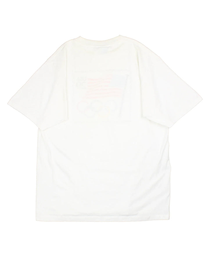 Vintage 90's USA Olympics Graphic T-Shirt in a white colourway, with graphic printed on front.