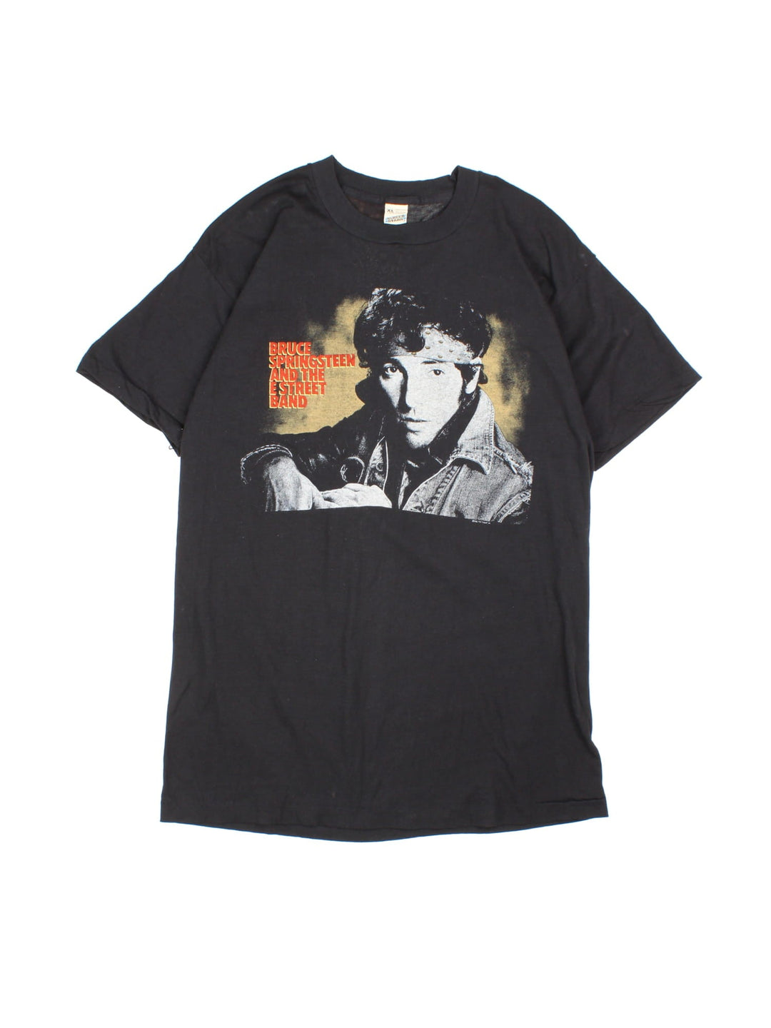 Vintage 1985 Bruce Springsteen World Tour T-Shirt in a black colourway with photo graphic printed on the front and band spell out and graphic on the back.