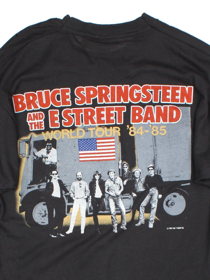 Vintage 1985 Bruce Springsteen World Tour T-Shirt in a black colourway with photo graphic printed on the front and band spell out and graphic on the back.