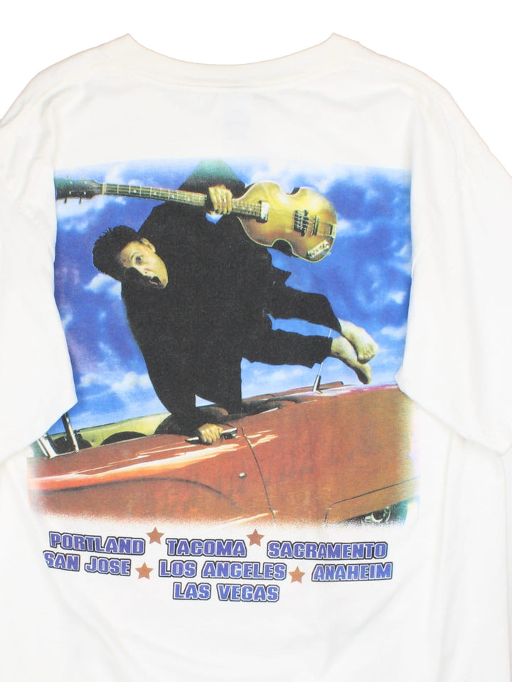 Vintage 2002 Paul McCartney Back In The US Tour T-Shirt in a white colourway with graphic print on the front and back alongside spell out of tour locations.